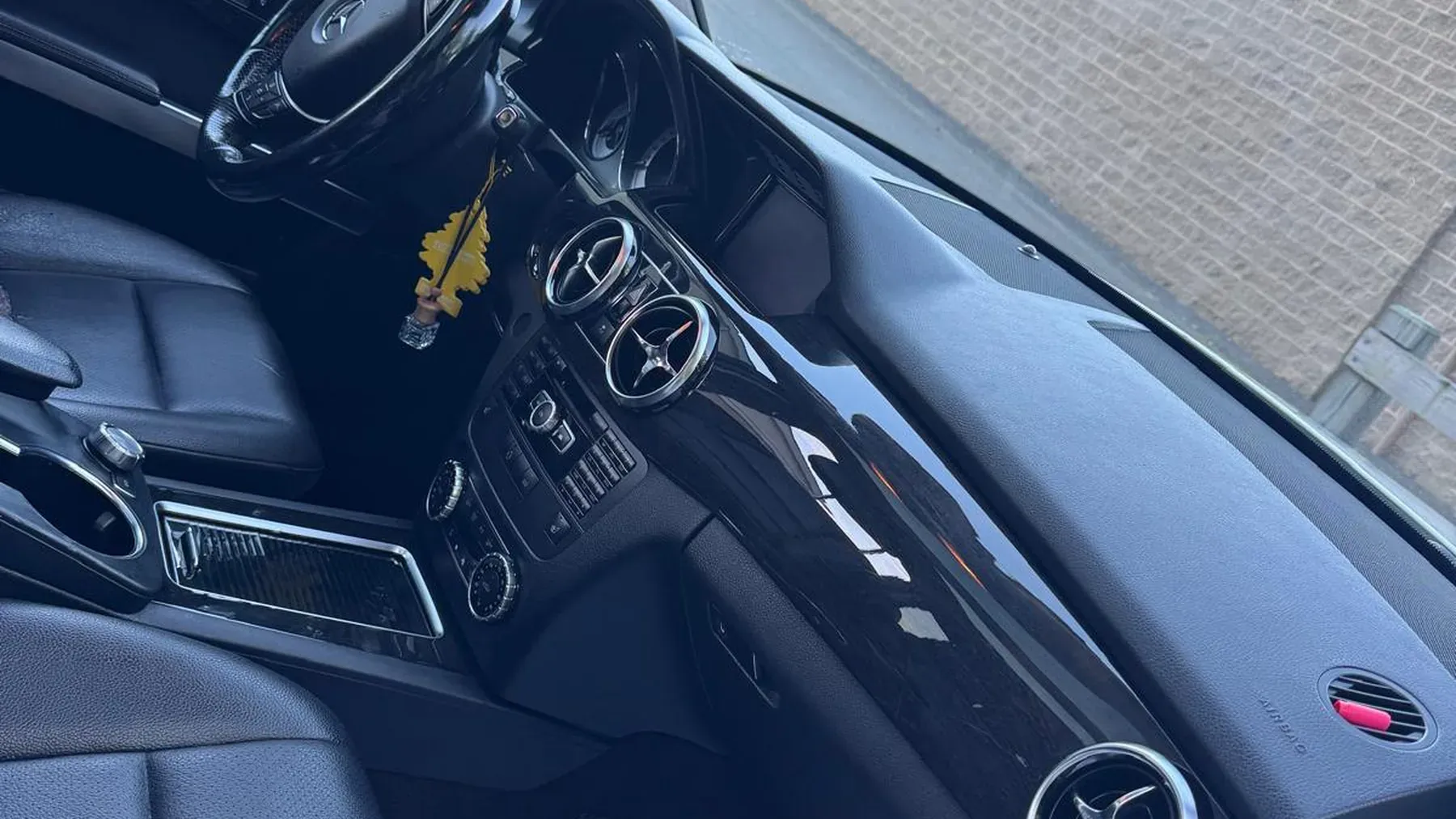 Detailed car interior with clean leather seats and dashboard