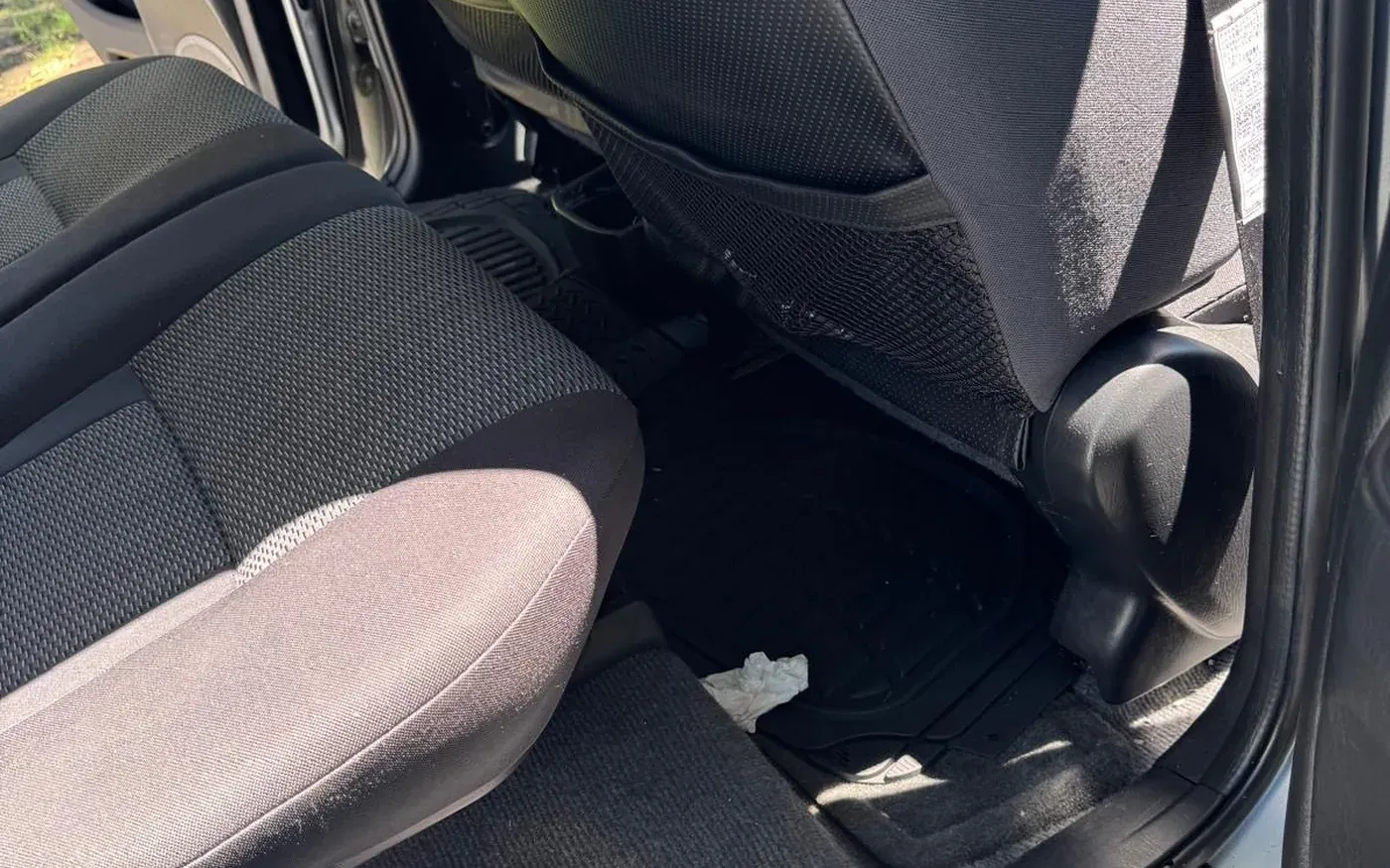 Clean rear seats and carpet after a scheduled maintenance detail