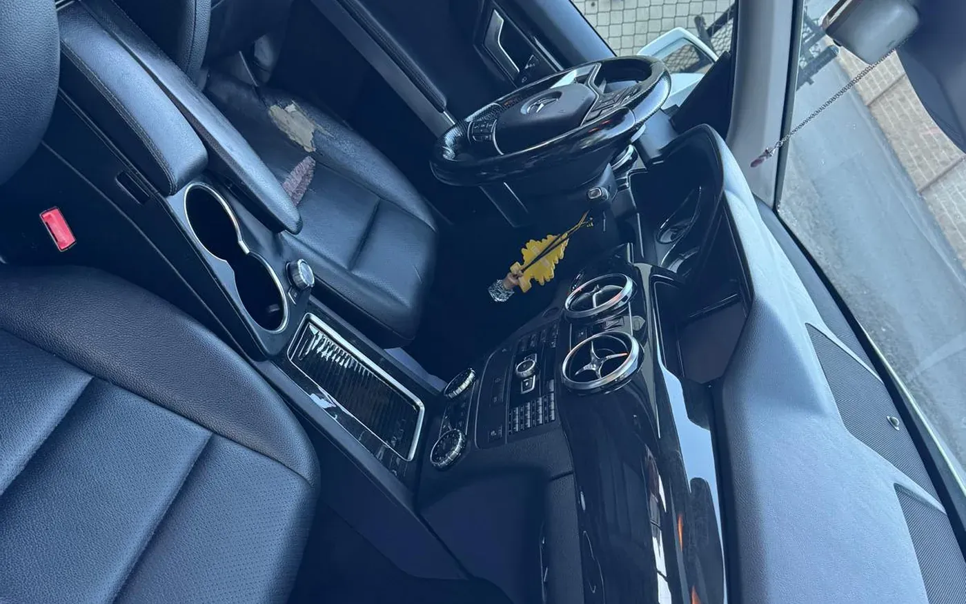 Freshly detailed leather car interior with clean dashboard and console